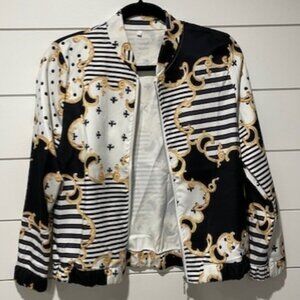 Black, white and gold colored bomber jacket